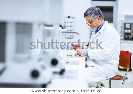 Stockfoto: Senior Male Researcher Carrying Out Scientific Research In A Lab