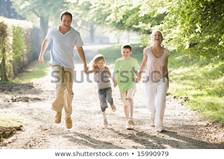 Foto stock: Boy Walking Bike In Countryside