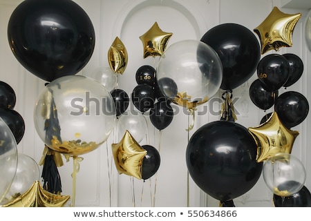 Stock fotó: Happy Woman In Dress With Helium Air Balloons