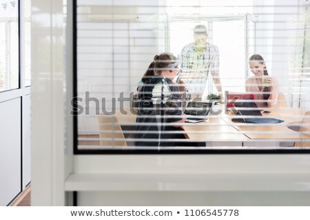 Close Up Of The Interior Window Of A Modern Work Hub With Shared Offices Foto stock © Kzenon