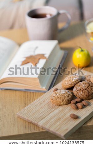 Stock fotó: Book Lemon Tea And Cookies On Table At Home