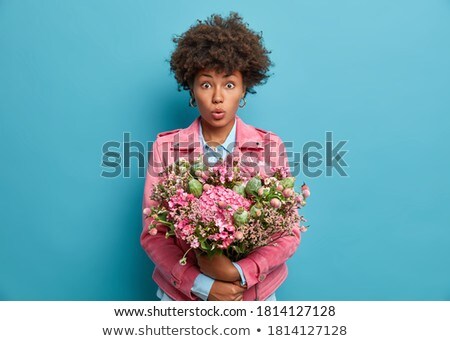 Foto stock: Horizontal Shot Of Pleasant Looking Curly Young Woman Embraces Lovely Pet Holds Cute Dog Smiles Br