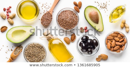 Stock fotó: Bowl Of Raw Natural Organic Linseed Flaxseed Oil And Omega 3 Capsules On Light Table Background