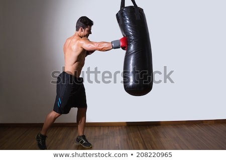 Stock fotó: Shirtless Muscular Boxer With Punching Bag In Gym