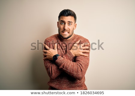 Foto stock: Upset Young Bearded Man Wearing Warm Sweater Standing