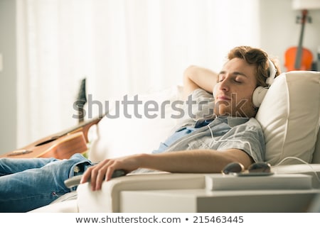 Stock photo: Man Lying Down On Sofa And Relaxing