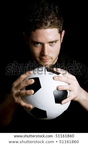 Stock Image Of Man Holding Soccer Ball Over Dark Background Stockfoto © iodrakon
