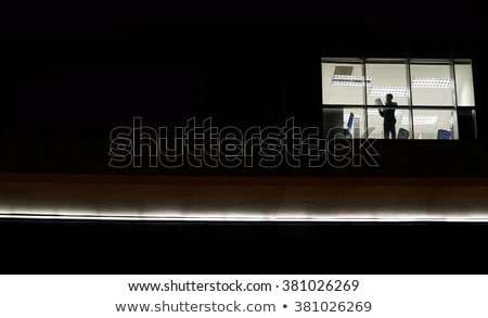 Foto stock: Businessman In The Office At Night