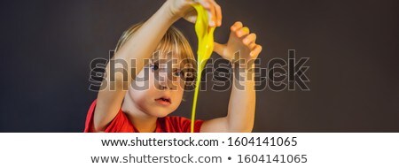 Сток-фото: Boy Playing Hand Made Toy Called Slime Child Play With Slime Kid Squeeze And Stretching Slime