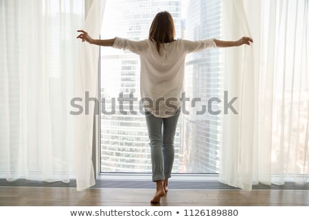 Stok fotoğraf: Beautiful Young Woman Enjoying Sunlight In A Luxurious Hotel Ro
