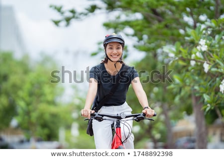 Stockfoto: Happy Young Woman Riding Bicycle Outdoors