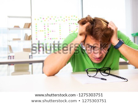 Stok fotoğraf: Student Struggling At The Exam In Classroom