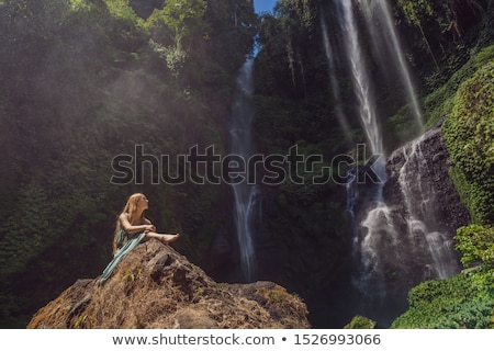 Stock fotó: Woman In Turquoise Dress At The Sekumpul Waterfalls In Jungles On Bali Island Indonesia Bali Trave