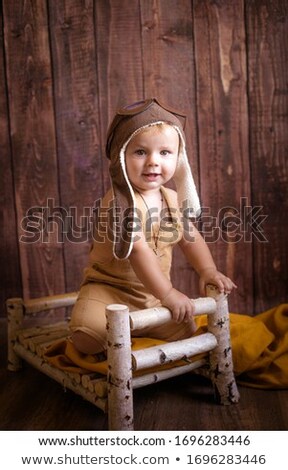 Сток-фото: Portrait Of Boy Standing In Wood Cradle