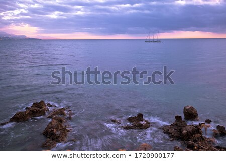 Sailboat On French Riviera Coast On Moody Sunset View Foto stock © xbrchx