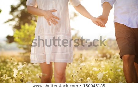 Foto stock: Young Pregnant Couple On Nature
