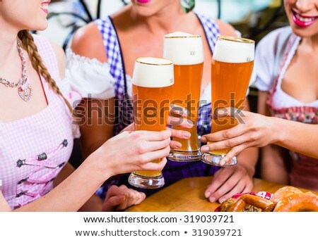 Woman Wearing Dirndl And Drinking Oktoberfest Beer Stockfoto © Kzenon