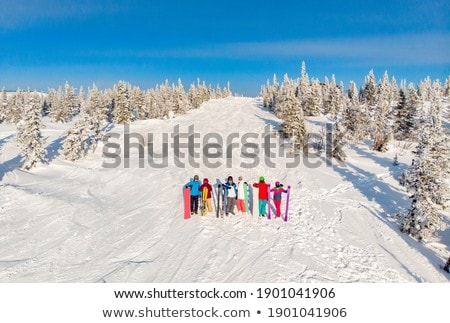 ストックフォト: Young Couple Getting Ready To Go Snowboarding