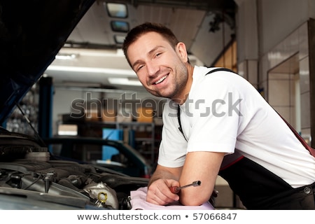 Stok fotoğraf: Handsome Mechanic Based On Car In Auto Repair Shop