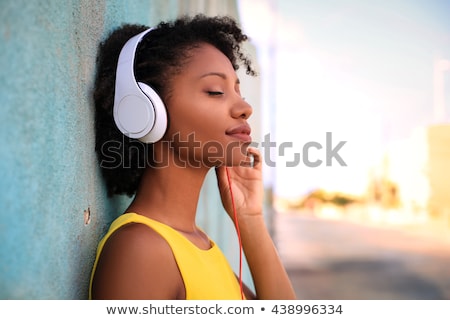 Foto stock: African Woman In Headphones Listening To Music