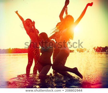 Foto d'archivio: Dancing Happy Girl On The Beach