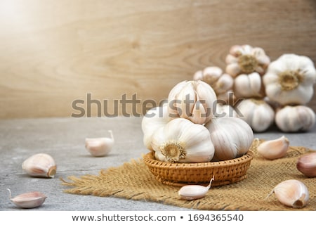 Stockfoto: Garlic On The Brown Fabric