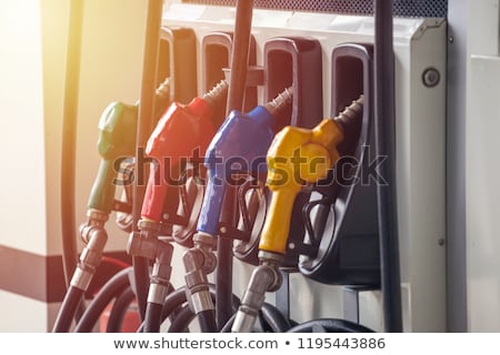 Stock fotó: Gas Pump Nozzles In A Service Station