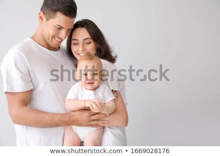 Stock fotó: Happy Parents With A Baby