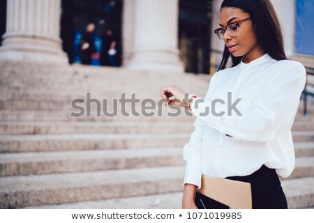 Stockfoto: Businesswoman Checking Time