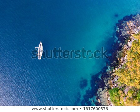 Stok fotoğraf: Single Yacht Alone In A Blue Bay