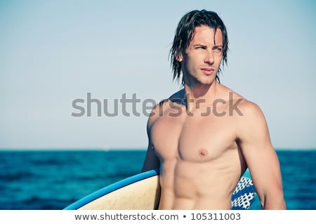 Foto d'archivio: Surfer Fun On Summer Beach - Handsome Man