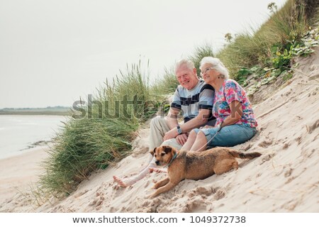 [[stock_photo]]: Family Sitting On The Sand Dunes