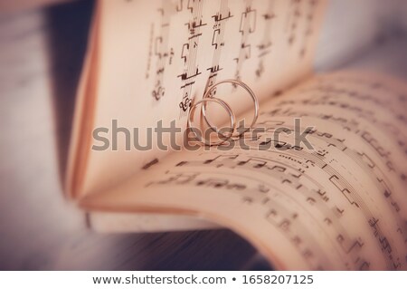 ストックフォト: Piano Keyboard And Wedding Rings