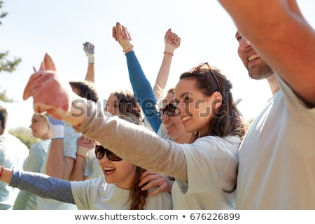 [[stock_photo]]: Group Of Volunteers Celebrating Success In Park