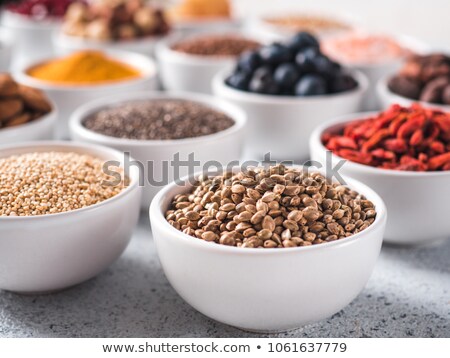 Foto stock: Various Superfoods In Small Bowl On Blue Background