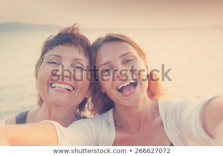 Foto stock: Beautiful Mother And Young Adult Daughters Portrait Outdoors