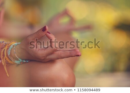 Stock photo: Woman Practicing Yoga In A Tropical Park