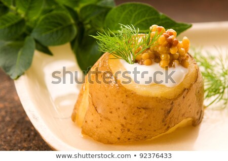 Stock fotó: Baked Potato With Sour Cream Grain Dijon Mustard And Herbs