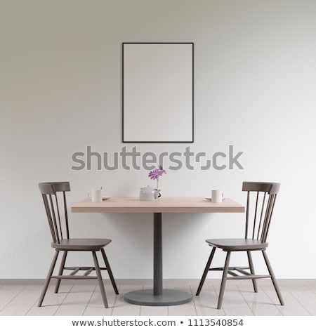 Foto stock: The Wooden Frame On The Wall And Teapot With Cup Of Tea On The