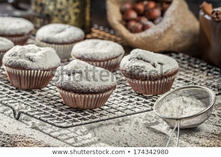 Foto stock: Muffins With Cinnamon And Icing Sugar