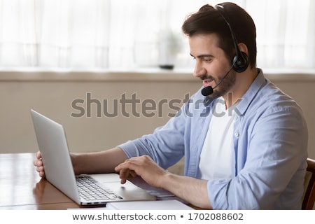 Zdjęcia stock: Man Wearing Headset Giving Online Chat And Support