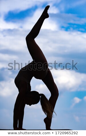 Stock fotó: Slender Girl Doing Acrobatic Stunt