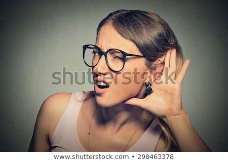 Stok fotoğraf: Portrait Of A Young Curious Girl Trying To Hear Rumors