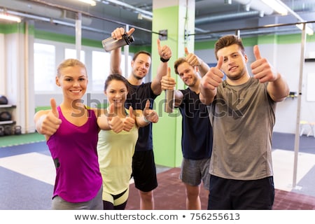 [[stock_photo]]: Happy Sportive Man And Woman Showing Thumbs Up