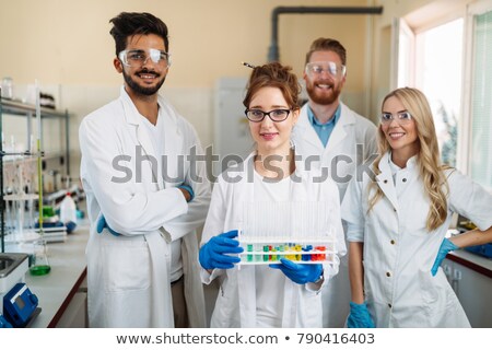 Stok fotoğraf: Young Chemist Student Working In Lab On Chemicals