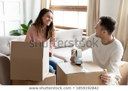 Foto d'archivio: Young Couple Moving To New Flat With Fragile Things