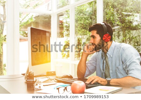 Foto stock: Young Businessman In His Office