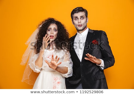 Foto d'archivio: Photo Of Beautiful Zombie Couple Bridegroom And Bride Wearing We