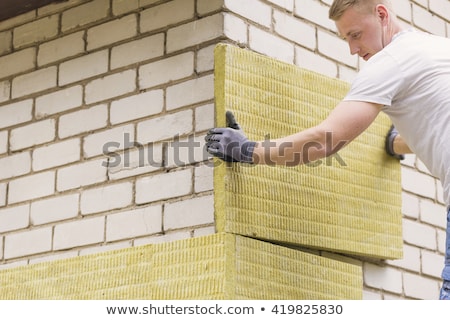 [[stock_photo]]: Insulating House Exterior With Mineral Rock Wool