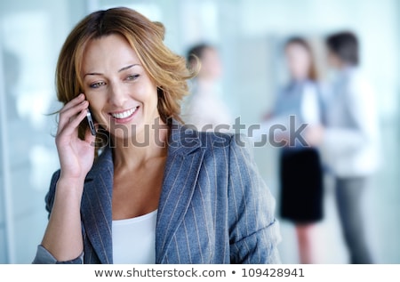 Businesspeople Talking On Mobile Phones Stockfoto © Pressmaster